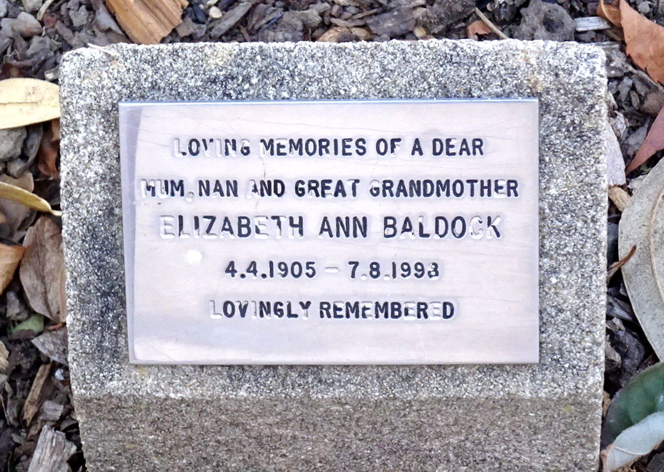 A small memorial plaque reading "Loving memories of a dear Mum, Nan and great grandmother, Elizabeth Ann Baldock, 4.4.1905 - 7.8.1998, lovingly remembered."